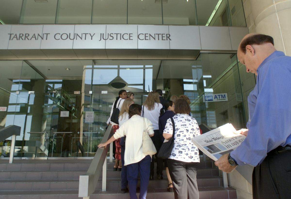 Tarrant County court buildings are evacuated after a bomb threat the day after the Sept. 11, 2001, terrorist attacks.