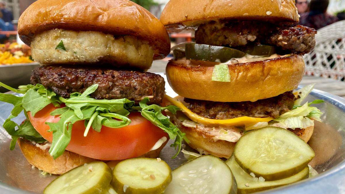 Rodeo Goat’s “Battle of the Burgers” pits a crabcake-burger “Biden,” left, against “The McDonald,” a double-decker burger at right.