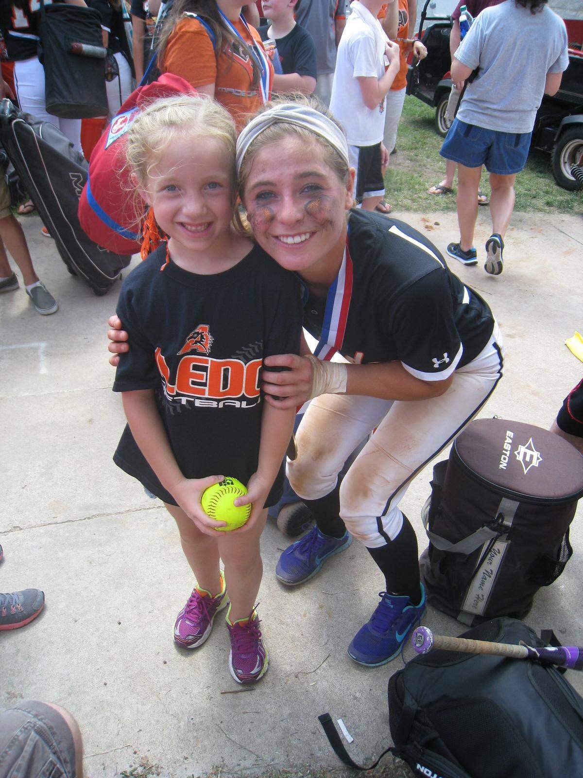 Aledo’s Breligh Mayer, now a senior, celebrates with former Aledo shortstop Allie Arneson after the Bearcats won the 2014 state championship at Red & Charline McCombs Field at the University of Texas in Austin, Texas, May 31, 2014.