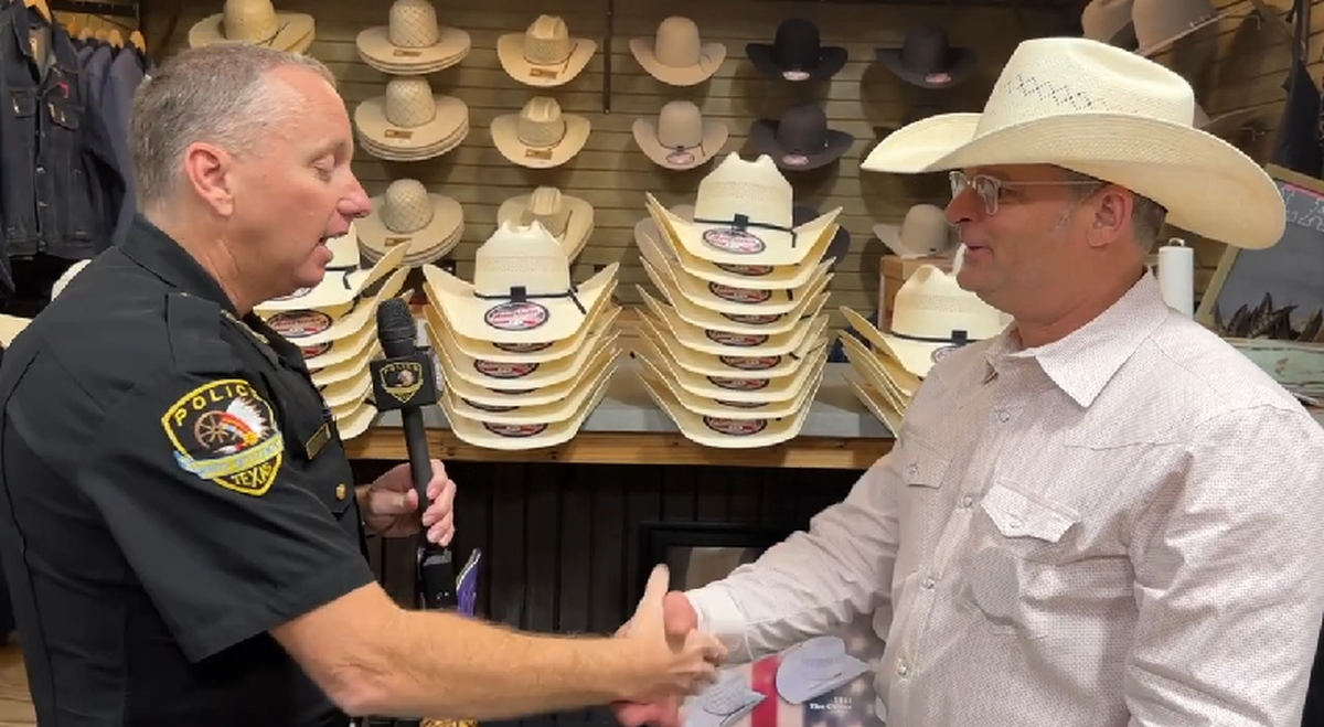 White Settlement Chief of Police Christopher Cook spoke with Brad Humphries, owner of Lazy J Ranch Wear, after authorizing officers to wear western-style hats when in uniform.