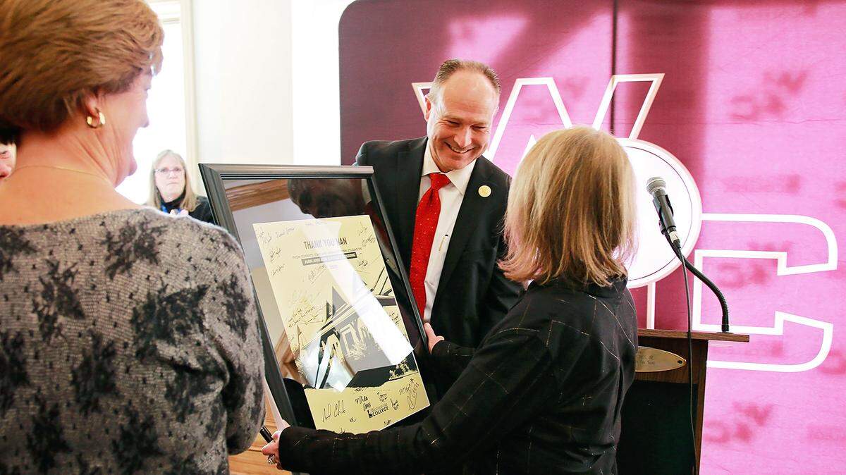 Weatherford College President Tod Allen Farmer accepts the donation of the Nan and Bob Kingsley Building, where the late Bob Kingsley recorded his popular country music countdown shows. It is now the home of Weatherford College’s audio engineering program and mass communications.