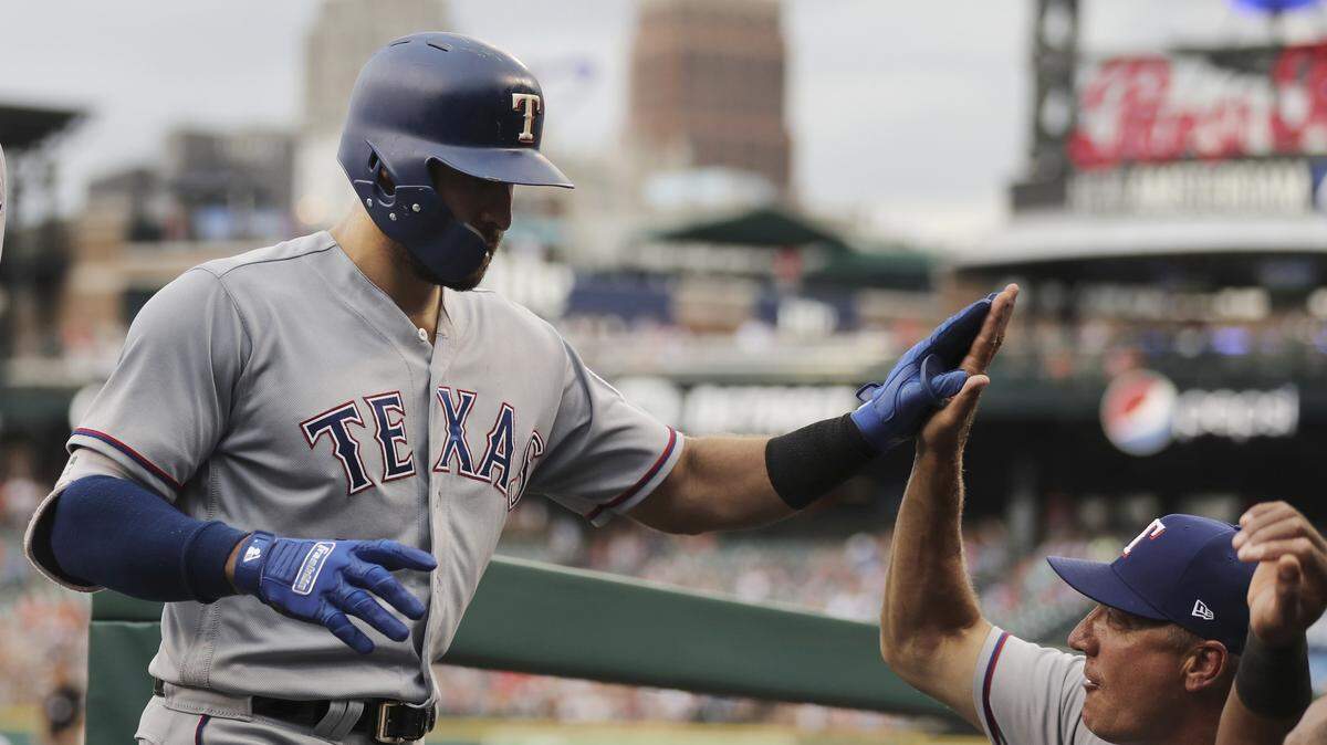Joey Gallo is greeted in the dugout after hitting a two-run home run in the second inning Thursday against the Detroit Tigers. Gallo's homer was estimated to be 453-feet, his second-longest this season.