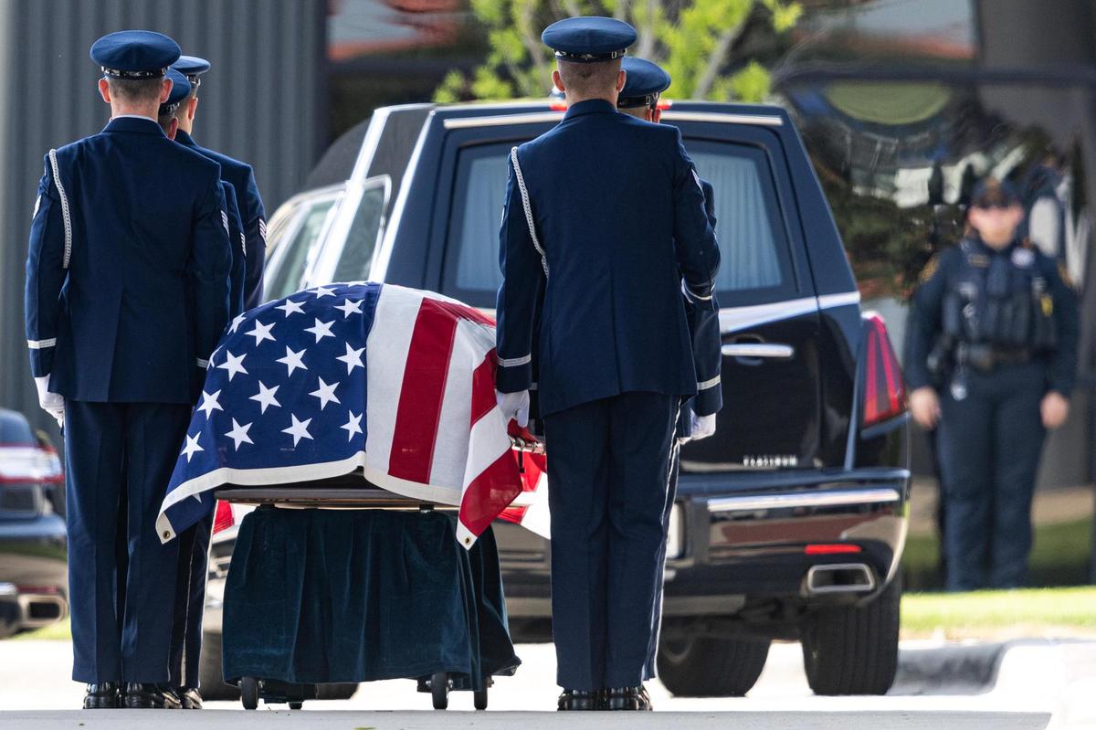 A U.S. Air Force Color Guard carries out the American Flag-draped coffin of Ava Moore during the military ceremony following her funeral at the Met Church on Saturday, May 31.