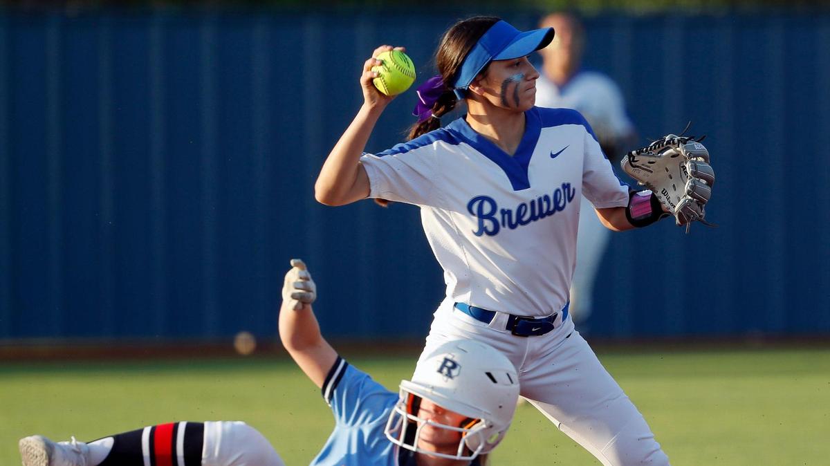 Richland second baseman Kylie Valencia (1) is out at second as Brewer short stop Mia Serrato (3) attempts a double play at first during a 5A Region I Bi-District softball playoff game at Brewer High School in White Settlement, Texas, Friday, April 30, 2022. Richland defeated Brewer 12-3 to move on to the next round. (Special to the Star-Telegram Bob Booth)