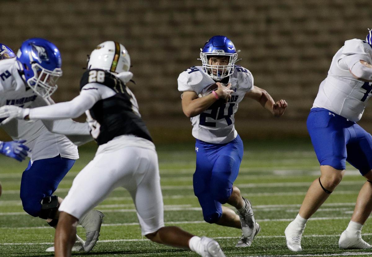 Weatherford’s Xavier Craven finds a hole to run through during a UIL football game at Vernon Newsome Stadium on Friday November 8, 2024.