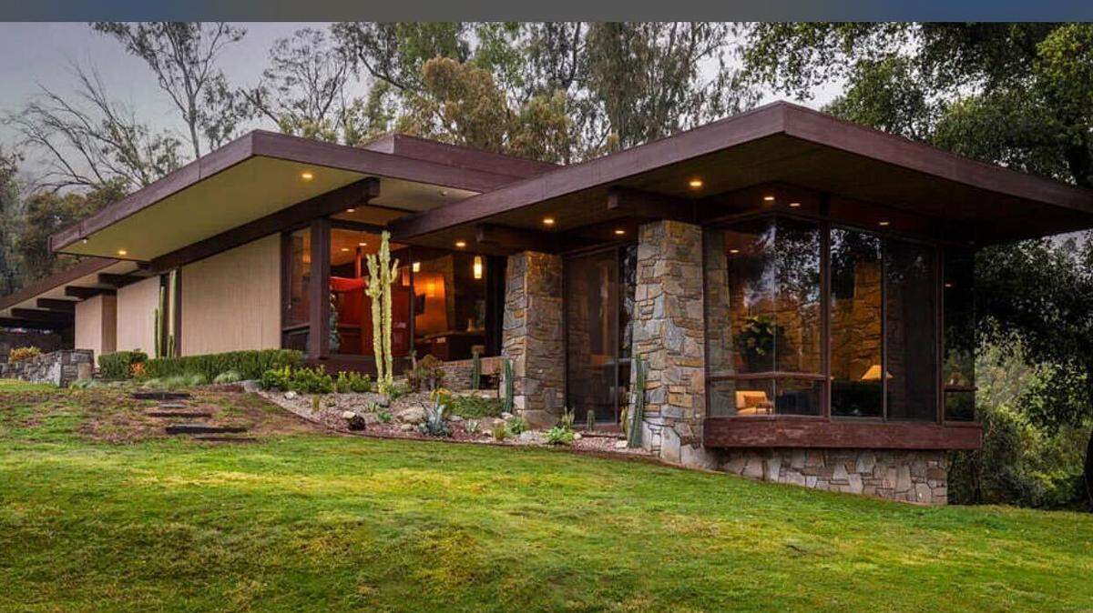 The exterior of the house has a rustic charm to it.