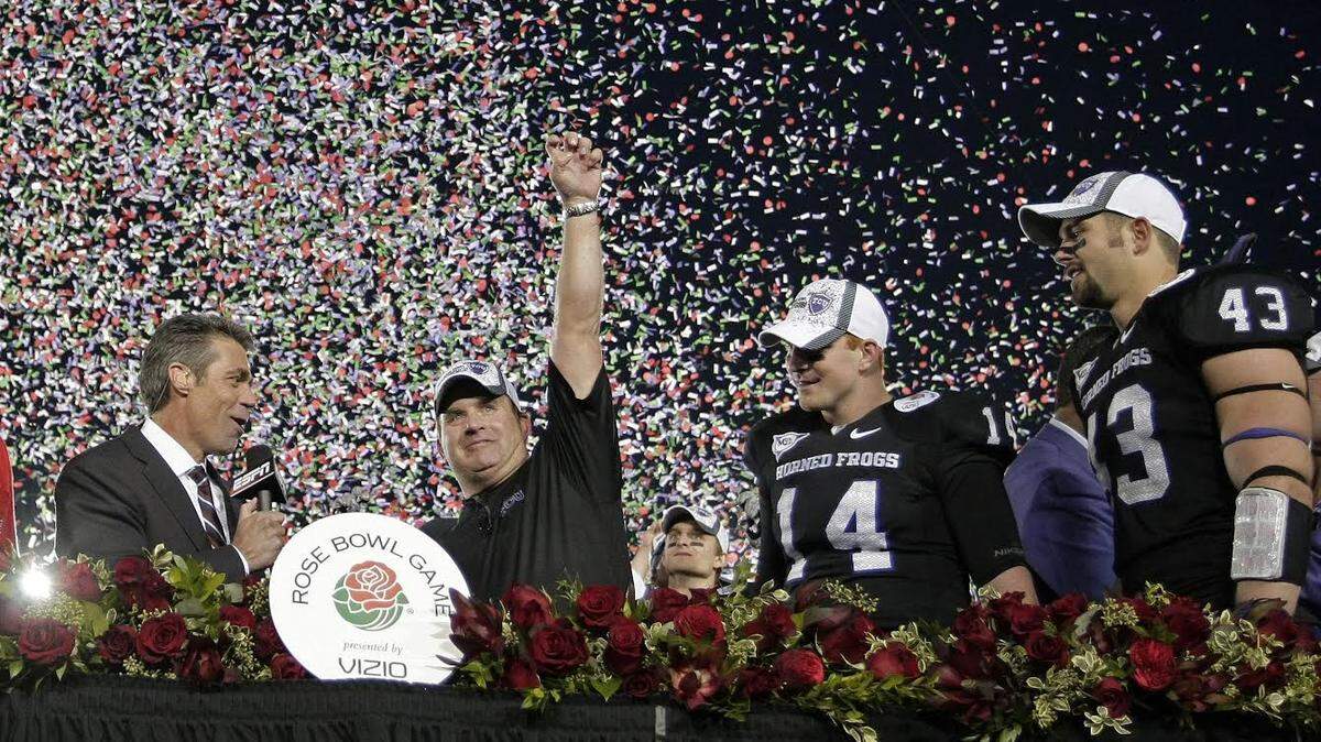 Texas Christian University head coach Gary Patterson, TCU quarterback Andy Dalton (14) and linebacker Tank Carder (43) during the awards ceremony,following TCU’s 21-19 victory over Wisconsin at the Rose Bowl in Pasadena, California, Saturday, January 1, 2011.