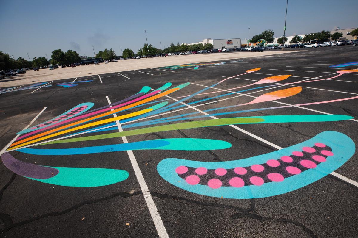 A mural painted in the parking lot outside of Meow Wolf in Grapevine on Wednesday, June 12, 2024. The mural was painted by artist Lauren Lewchuck.