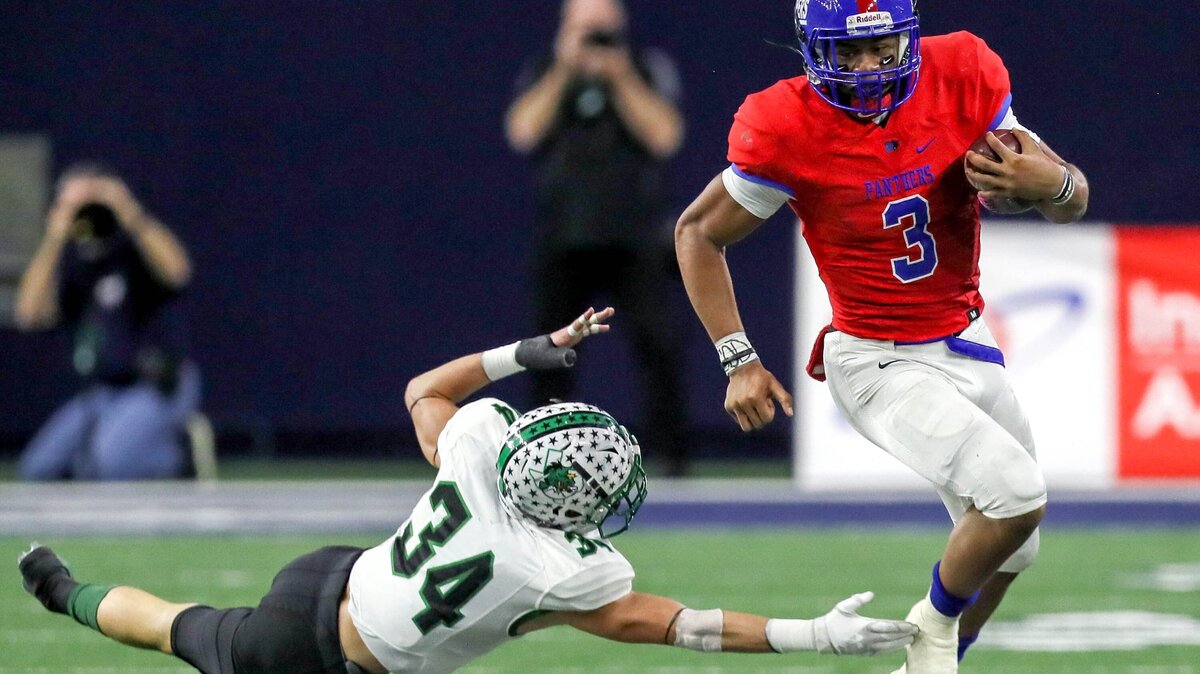 Duncanville quarterback Ja’Quinden Jackson (3) gets past Southlake Carroll linebacker Graham Faloona (34) during the first half, Saturday afternoon, December 8, 2018 in the 6A Division I quarterfinal playoff game played at the Ford Center in Frisco, TX.