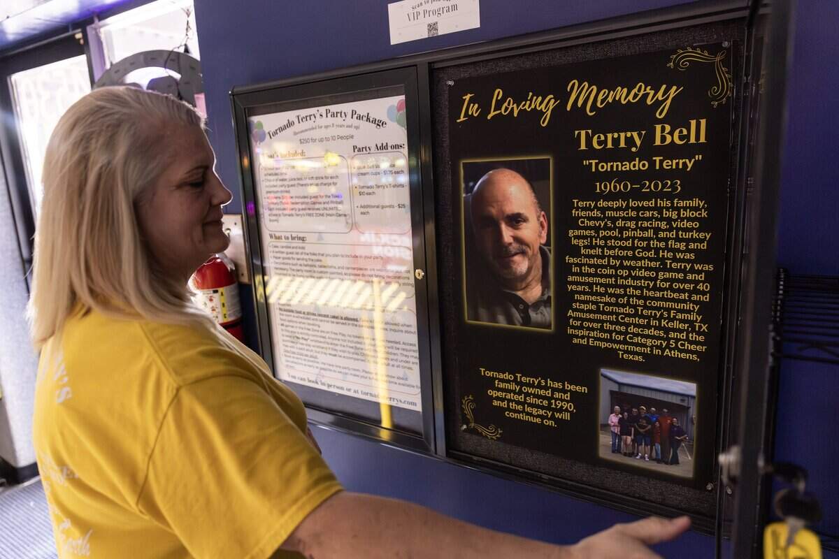 Shannon Bell, the owner of Tornado Terry's, looks at the poster dedicated to her late husband Terry, who ran the business with her and passed away in 2023, in Keller on Friday, Nov. 14, 2025.