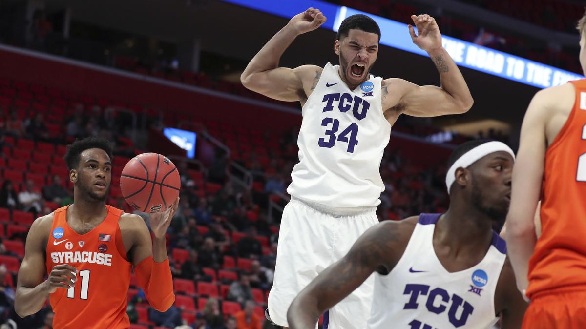 TCU guard Kenrich Williams (34) reacts after a dunk during the second half of a first-round game against Syracuse in the NCAA college basketball tournament Friday, March 16, 2018, in Detroit.