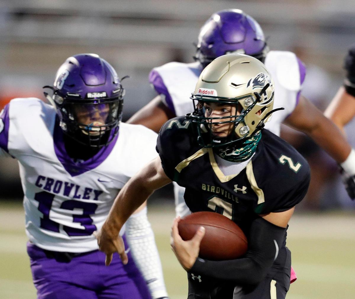 Birdville quarterback Aiden Dollar (2) gains yardage on a keeper during a high school football game at Birdville FAAC in North Richland Hills, Texas, Friday, Oct. 09, 2020. Birdville defeated Crowley 21-14. (Special to the Star-Telegram Bob Booth)