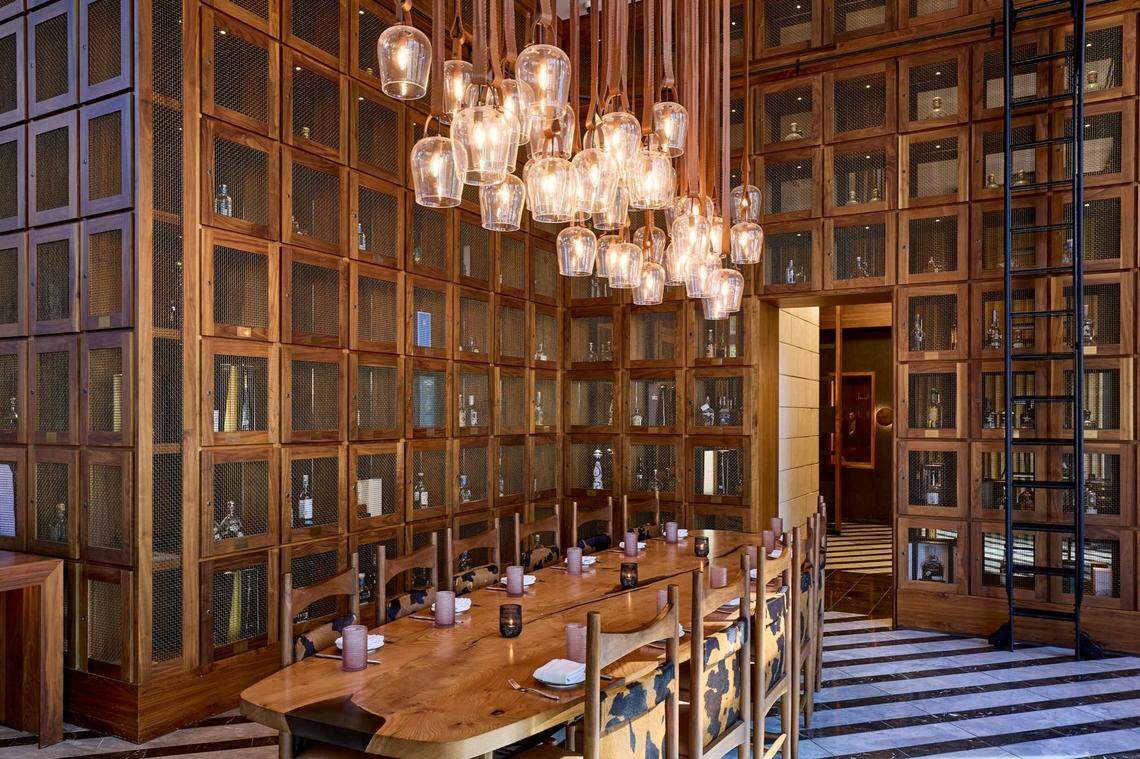 One of Toro Toro’s stunning dining areas that highlights the essence of Fort Worth through the textures of cowhide and wood as well as western art.