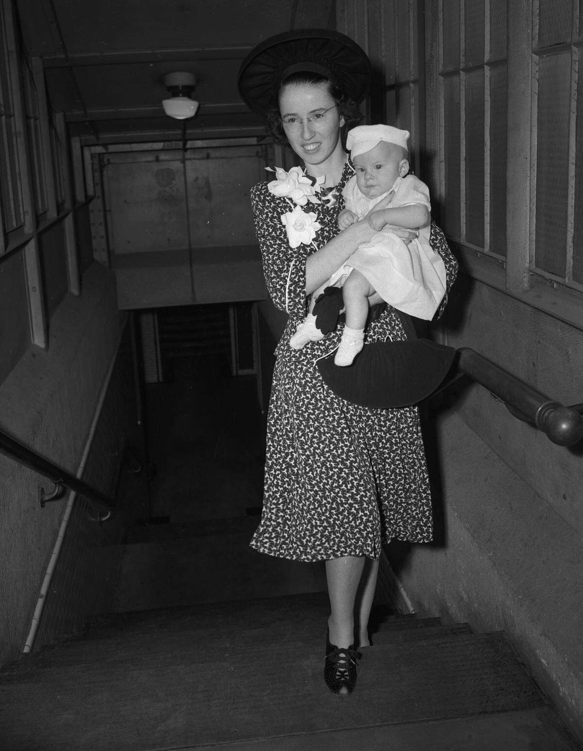 1941: Mrs. C.L. Dickerson carries her 3-month-old son, Jimmy, as she goes to board a train to Seattle on her way to Anchorage, Alaska, to join her husband, Lt. Dickerson, a former member of the Fort Worth police force who is stationed at Fort Richardson.