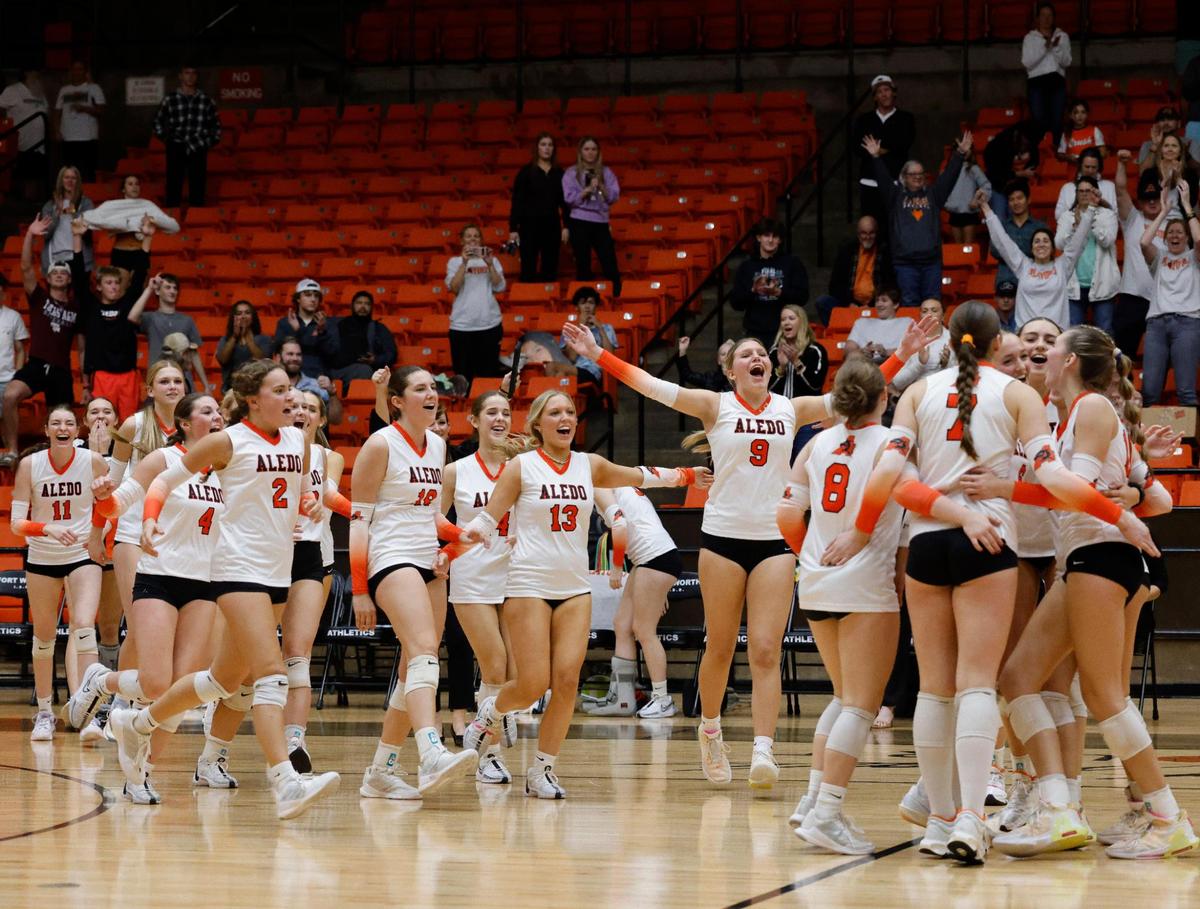 The Aledo Lady Bearcats celebrate winning the match in four sets after a UIL Region 1-5A Bi-District volleyball match at Wilkerson Greens Activity Center in Fort Worth, Texas, Tuesday, Nov. 05, 2024.