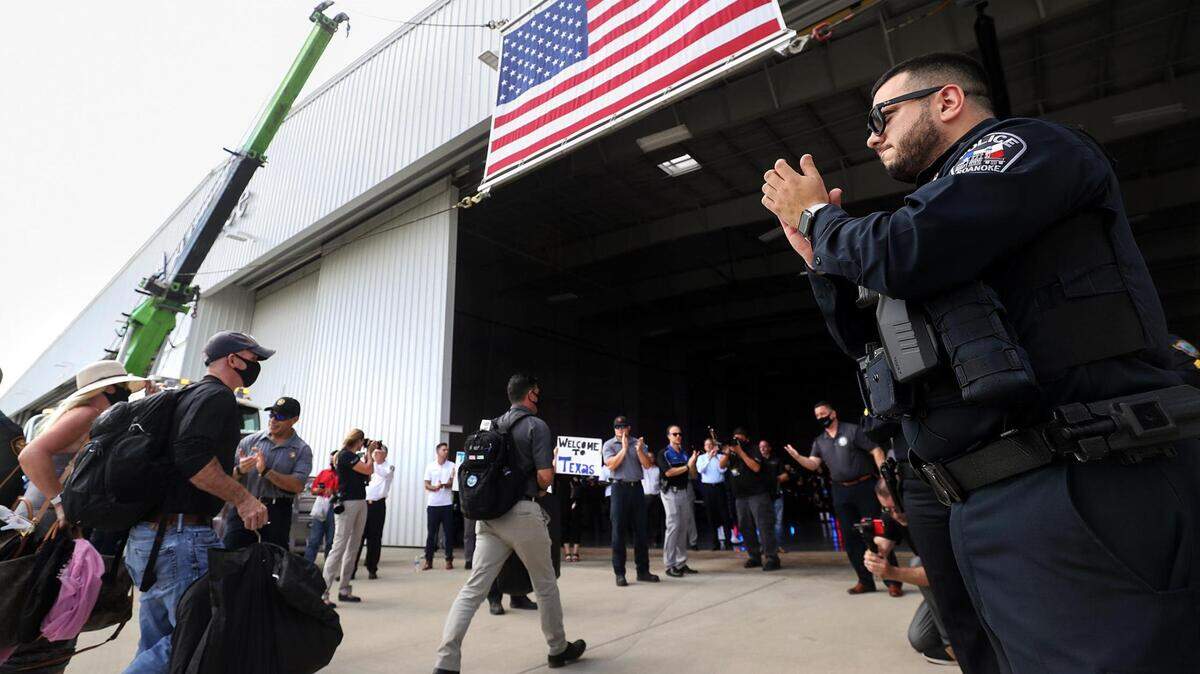 Police and firefighters from across Tarrant County applaud the arrival of police officers and firefighters who were present at Ground Zero in New York City to mark the upcoming 20th anniversary of 9/11 on Friday, Aug. 27, 2021. “Freedom rings here every day because of what you did 20 years ago,” said Tarrant County Sheriff Bill Waybourn to heroes who served during 9/11.