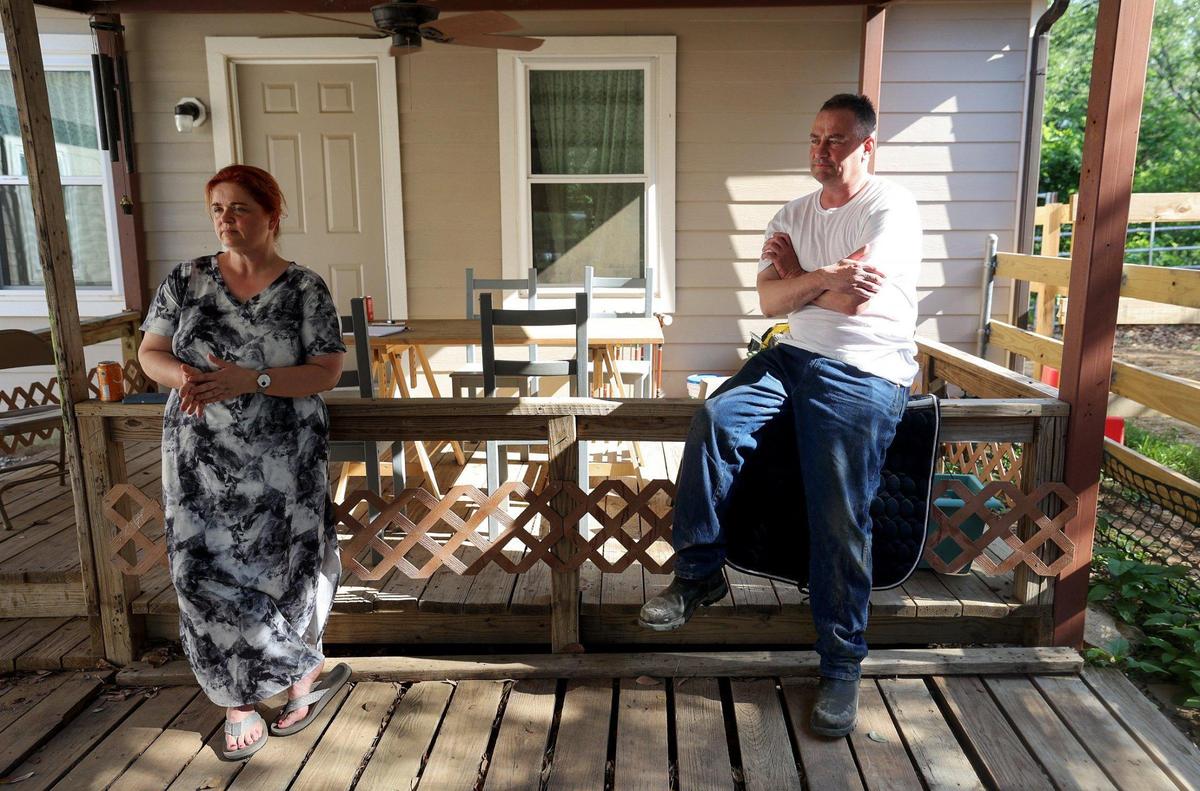 Kate Zimmerman, left, and Neil Foreman discuss their concerns about new development across the street from their homes on Eden Road South. An 18-wheeler truck lot was recently built, which they say creates noise pollution and an influx of traffic on the narrow road.