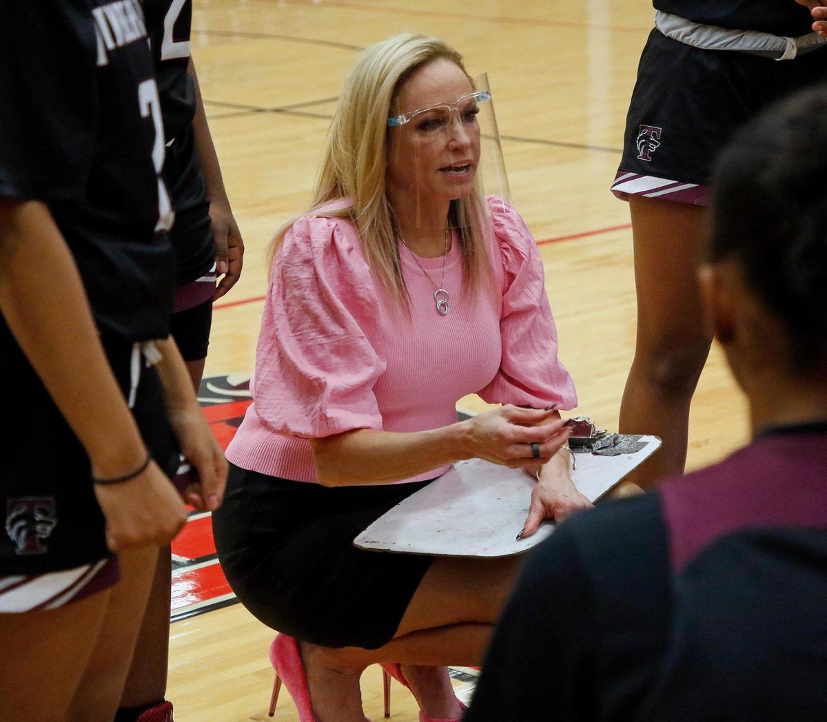 Timberview head coach Kit Kyle Martin talks to the team during a timeout in the first half of a 8-5A district high school girls basketball game at Legacy High School in Mansfield, Texas, Friday, Jan. 22, 2021. The Lady Broncos led the Lady Wolves 22-11 at the half. (Special to the Star-Telegram Bob Booth)