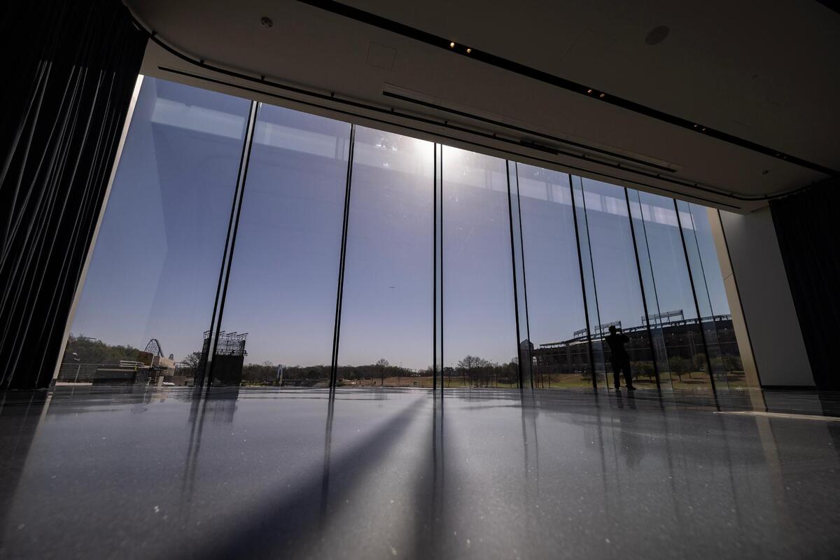 The glass windows in the Great Hall give museum goers a view of Mark Holtz Lake and Choctaw Stadium.