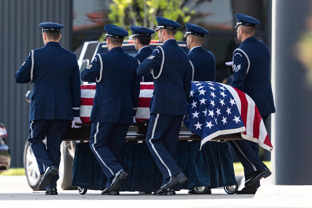 A U.S. Air Force Color Guard carries out the American Flag-draped coffin of Ava Moore during the military ceremony following her funeral at the Met Church on Saturday, May 31.