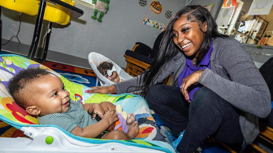 Infant teacher A’Aliyah Rhodes cares for infants Krue Williams, 4 months, and Jaela Bouck, 3 months, at the Sunrise Early Learning and Development Center in Fort Worth on Oct. 26, 2023.