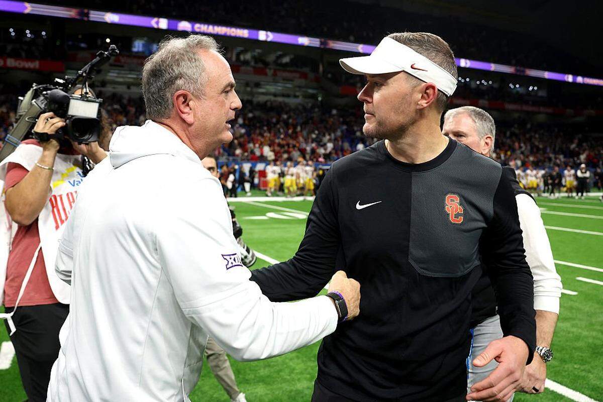 SAN ANTONIO, TEXAS - DECEMBER 30: Head coach Lincoln Riley of the USC Trojans and Head coach Sonny Dykes of the TCU Horned Frogs shake hands after the game at the Alamodome on December 30, 2025 in San Antonio, Texas. (Photo by Kenneth Richmond/Getty Images)
