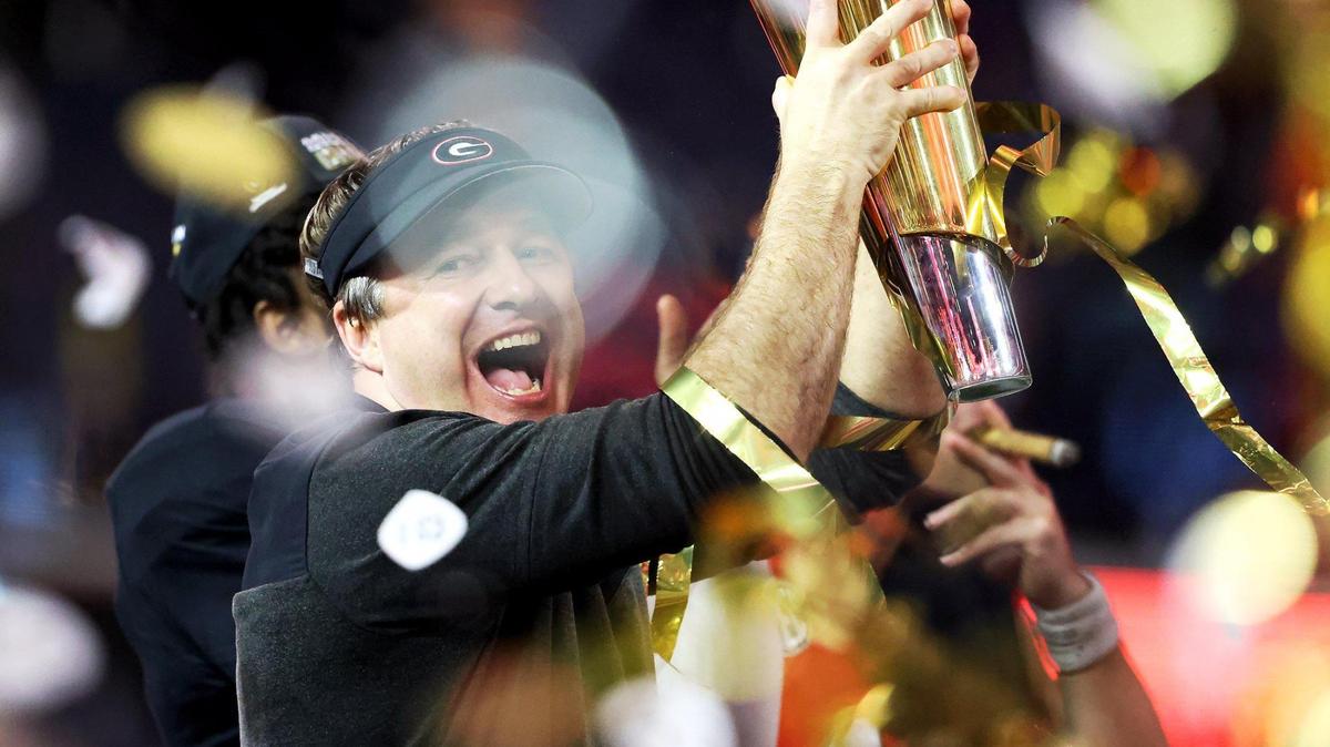 Georgia head coach Kirby Smith holds up the 2023 College Football Playoff National Championship trophy after defeating TCU on Monday, January 9, 2023, at SoFi Stadium in Inglewood, Calif.