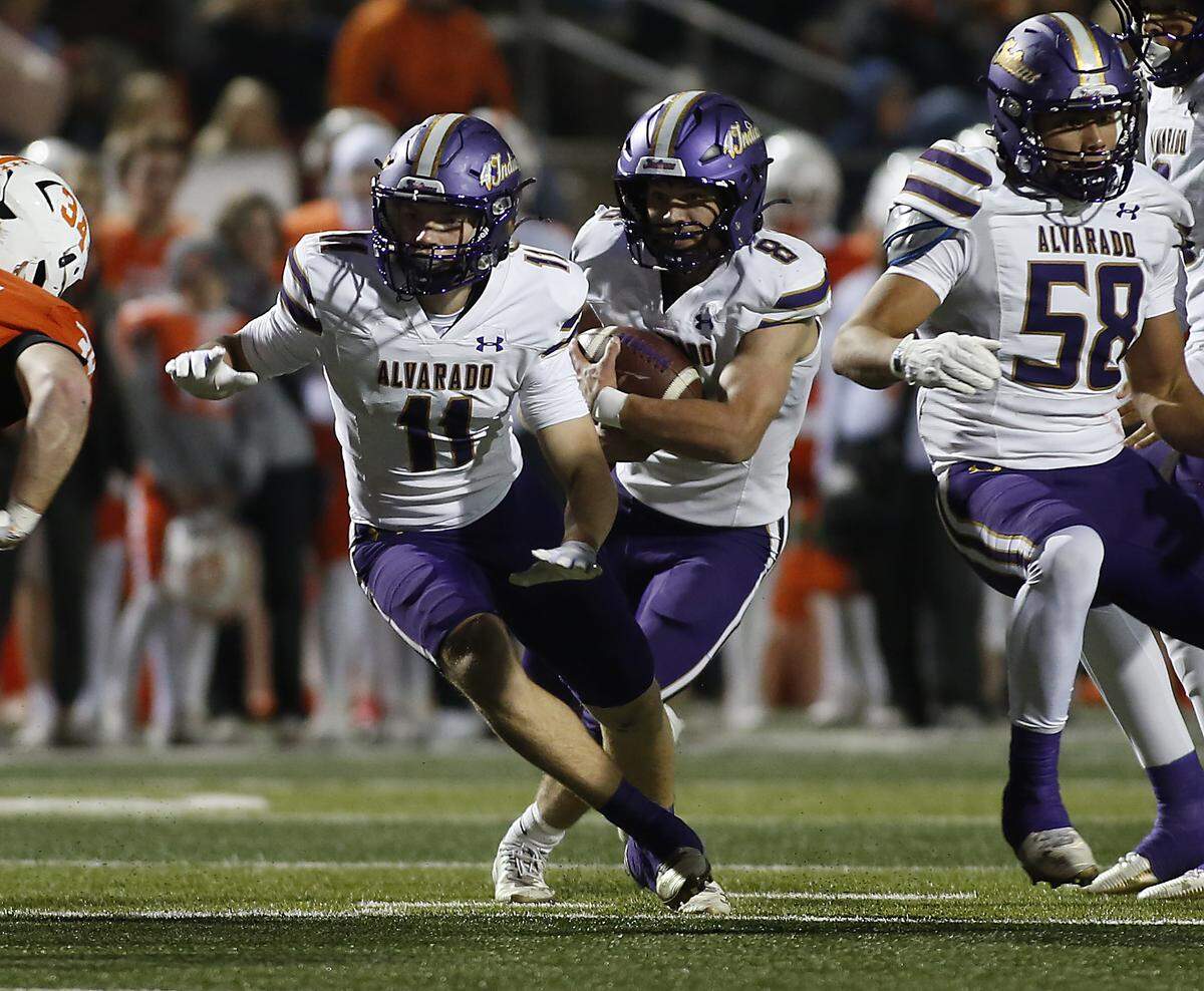 Alvarado’s DJ Clampitt follows the blocking of Paijton Fox and Anthony Frias against Celina’s during their Class 4A Division I quarter final game at Newsom Stadium on Friday, December 5, 2025, in Mansfield, Texas.
