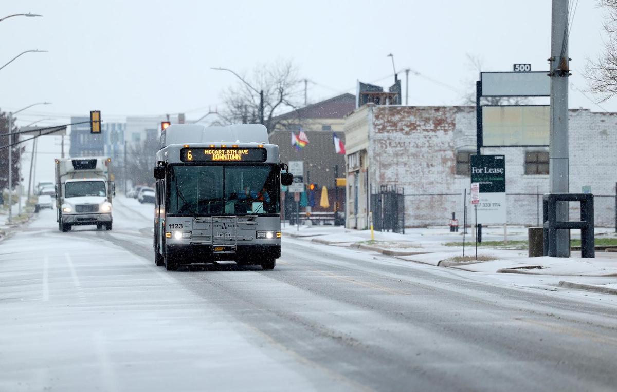 Vehicles slowly make their way on Jennings Street in Fort Worth during a winter storm on Thursday, Jan. 9, 2025, in Fort Worth.