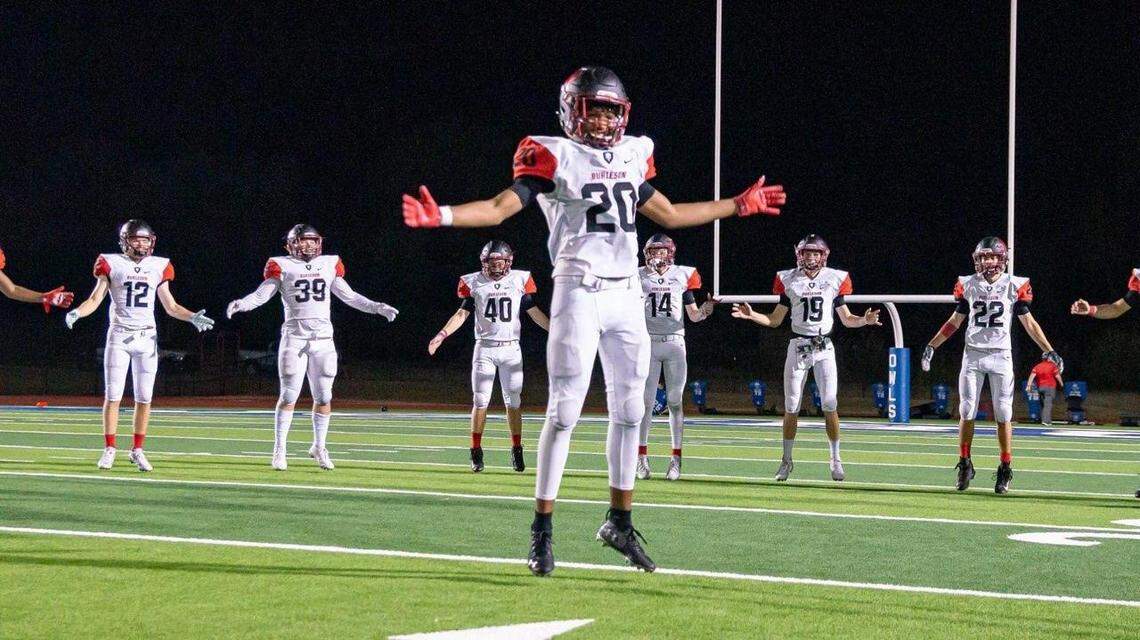 Tre Allison (center) leads the Burleson High School football team in stretches. The 16-year-old who was killed in a hit-and-run crash in June has been remembered as a leader on the team and a good friend off the field.