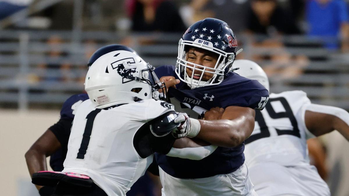 Denton Ryan offensive lineman Ty Haywood (70) blocks Timberview linebacker Caden Bates (1) during a UIL football game at C.H. Collins Activity Complex in Denton, Texas, Thursday, Sept. 05, 2024.