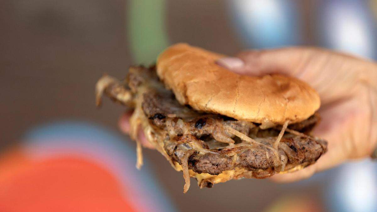 A double burger from Hookers Grill, the winner of the 2022 Reader’s Choice Best Burger in Fort Worth. The family-owned business offers classic and styled burgers with the option of a Native American twist.
