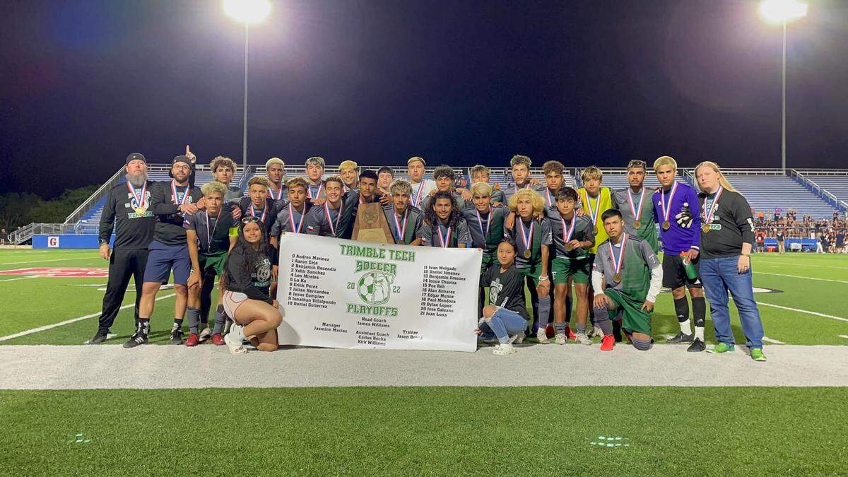 Trimble Tech poses with the state semifinals trophy after its 5A game with Wakeland on Thursday April 14, 2022.