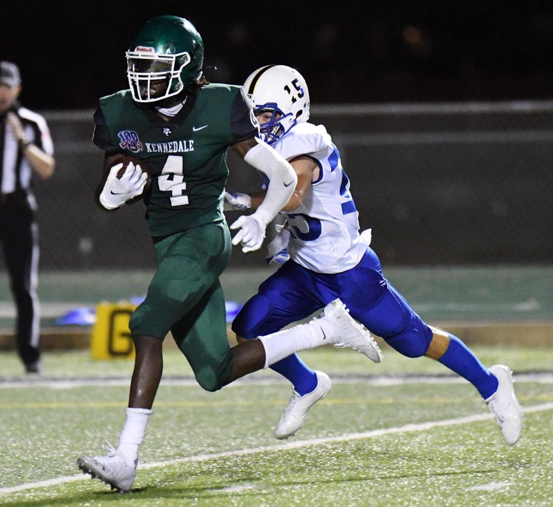 Kennedale’s Ife Adeyemi, left escapes Sunnyvale’s Brenden Gomez for a 35 yard touchdown run to cut the Sunnyvale lead 17-13 in the second quarterof their football game Friday, September 11, 2020 at Wildcat Stadium in Kennedale, Texas. Special/Bob Haynes