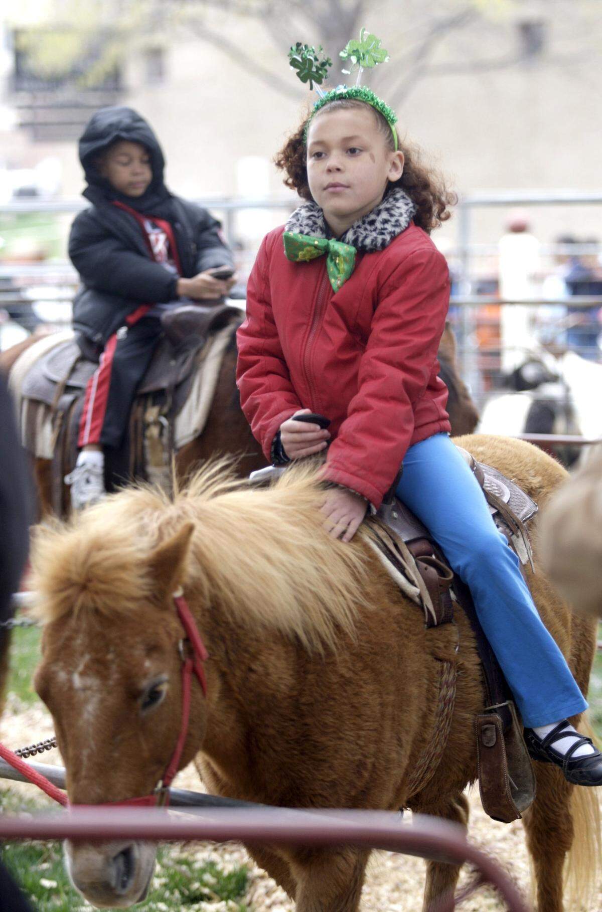 March 14, 2009: TaLynn Phillips, 8, of Joplin, Mo., rode a pony at the Fort Worth Stockyards’ 16th annual “Cowtown Goes Green Celebration” to recognize St. Patrick’s Day. TaLynn was visiting her grandmother in Weatherford.