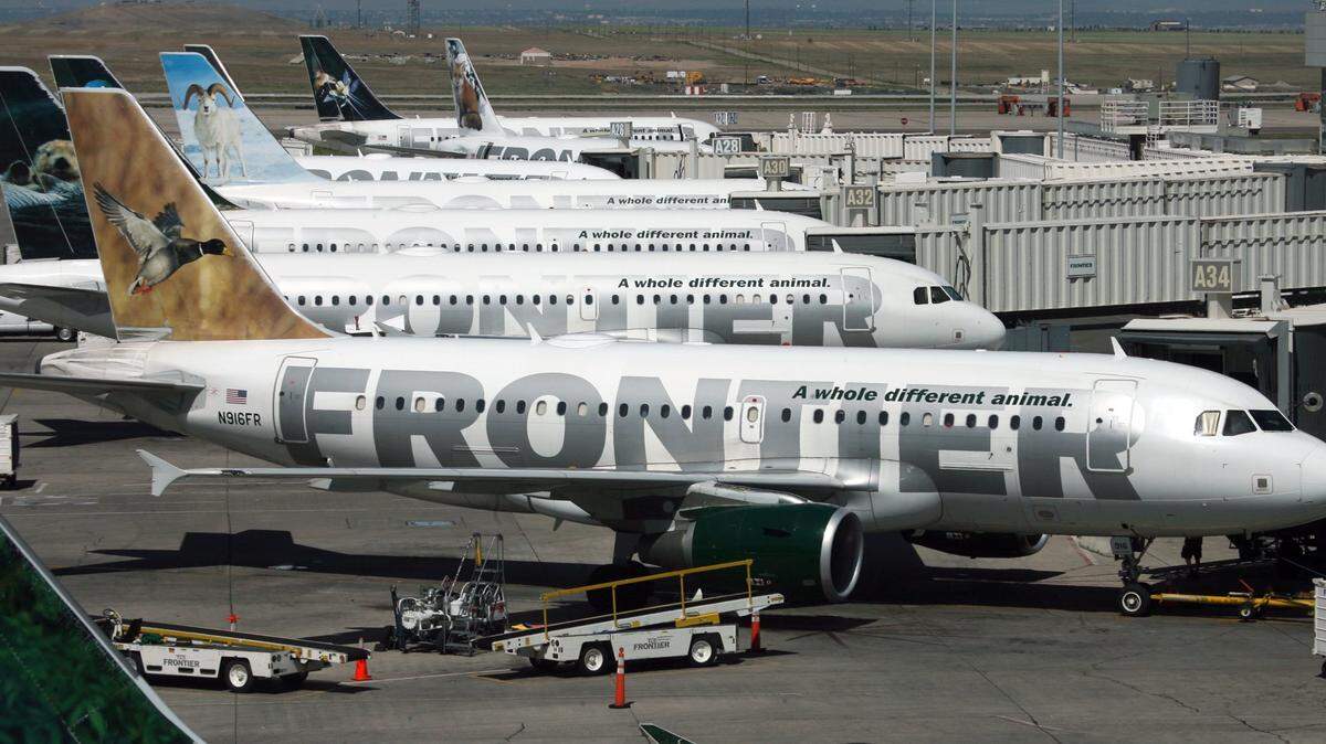 A Frontier plane in Denver. An Arlington mother said a Frontier attendant denied her a temporary boarding pass for her 11-year-old son's flight from DFW Airport to Denver on Friday morning.