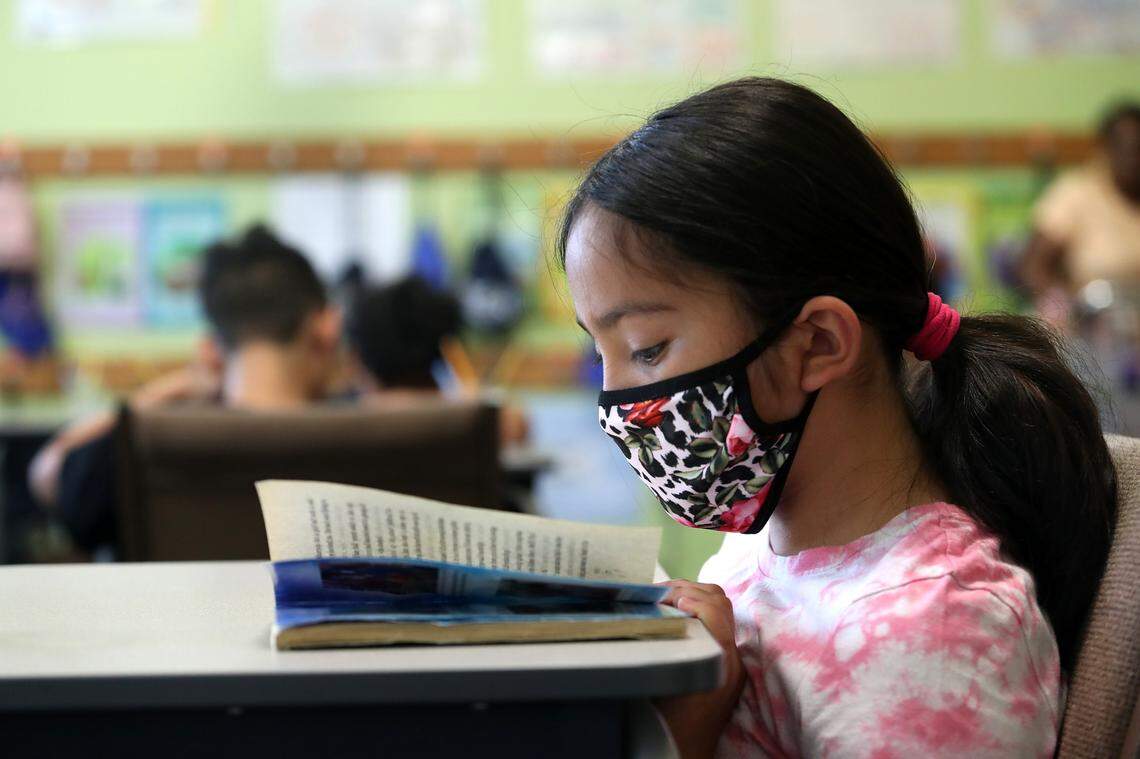 Maryjane Angel reads during a summer program to fight the “COVID slide” for young students at the United Community Centers Polytechnic Center on July 13, 2021, in Fort Worth. Many students are still dealing with the academic effects of the pandemic.