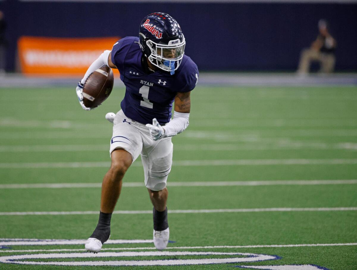 Denton Ryan defensive back Trae Williams (1) returns a pick six during the UIL 5A D1 Semifinals football game at The Ford Center in Frisco, Texas, Friday, Dec. 13, 2024.