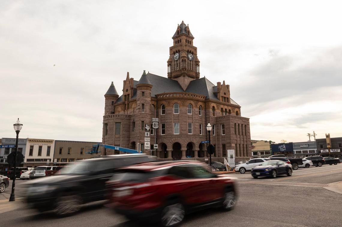 Cars drives down East Walnut Street past the Wise County Courthouse currently undergoing renovations in Decatur.