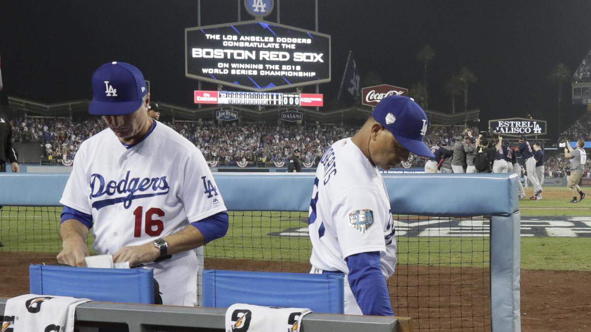 Dodgers manager Dave Roberts and bench coach Bob Geren headed to the losing dugout Monday after a second straight World Series loss.