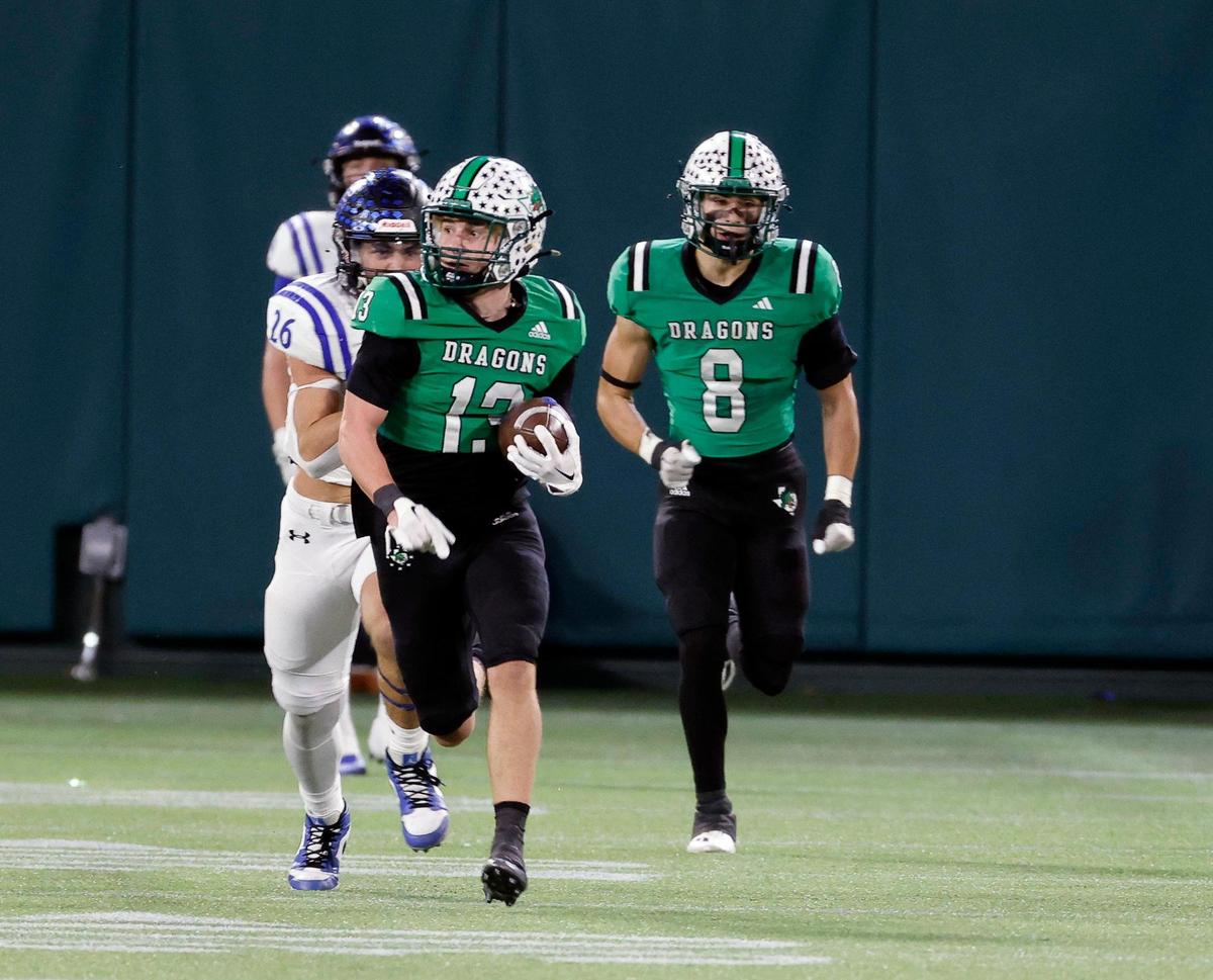 Carroll defensive back Trey Ferri (13) brings a pick back down field during the first half of a UIL Conference 6A Division 2 quarterfinal football playoff game at Choctaw Stadium in Arlington, Texas, Saturday, Dec. 02, 2023.