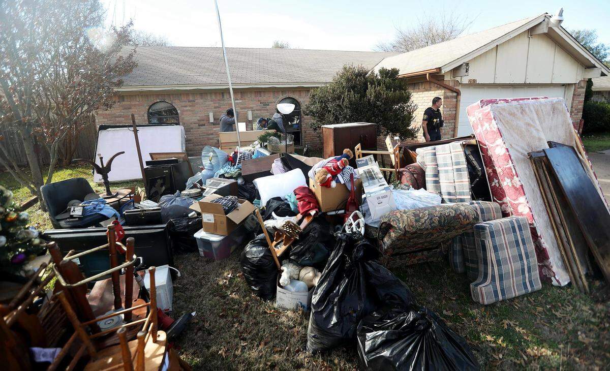 A crew removes the possessions of former tenants from a home in south Fort Worth after a writ of possession was served on Tuesday, February 2, 2021. The number of evictions filed in Fort Worth during the pandemic was down substantially from previous years, but they were still happening. Fort Worth saw some 13,500 eviction filings.