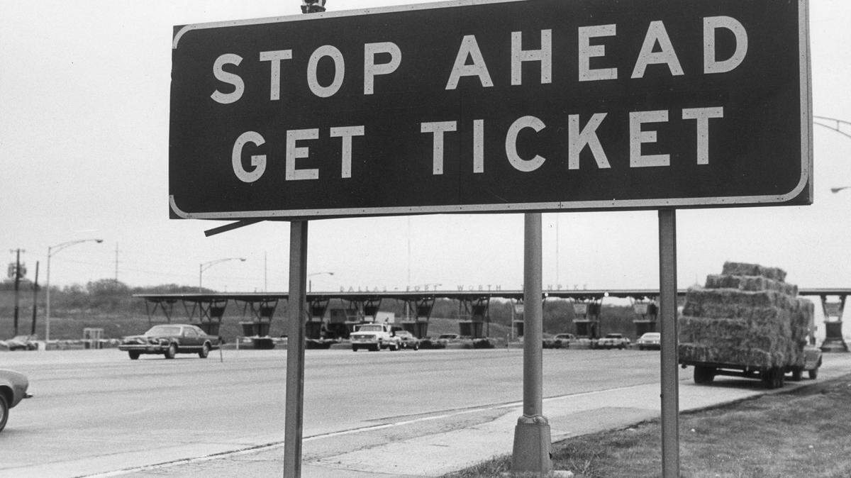 Dec. 30, 1977: A sign at the Dallas-Fort Worth Turnpike toll booths just before it was removed and the highway became the no-charge Interstate 30.