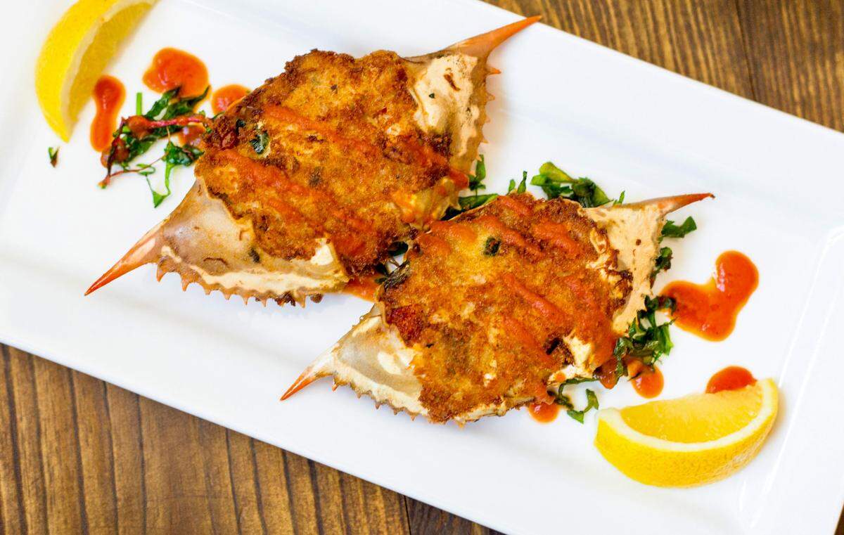Chef Tim Love served deviled crabs with house Lonesome Dove hot sauce and cured lemon at the Taste of the NFL charity event in Phoenix, Arizona, Feb. 11, 2023,