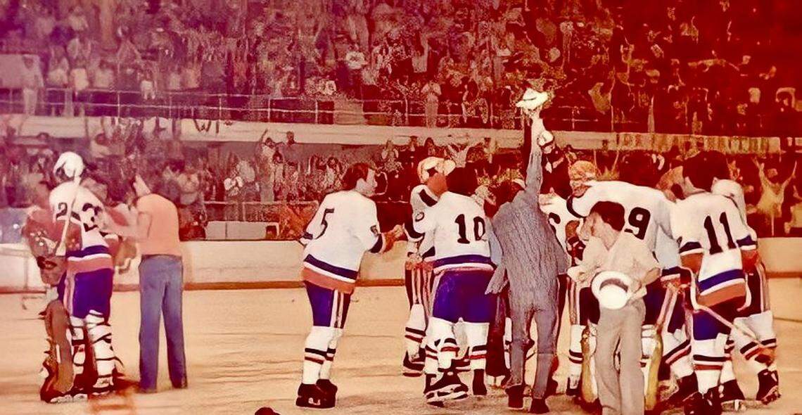 Fort Worth Texans celebrate their 1978 championship, including goalie Gary Smith, left, brawling defenseman Jim Boo (5), Dave Salvian (10), publicist Doug Helton with the trophy and player-coach Billy MacMillan (11).