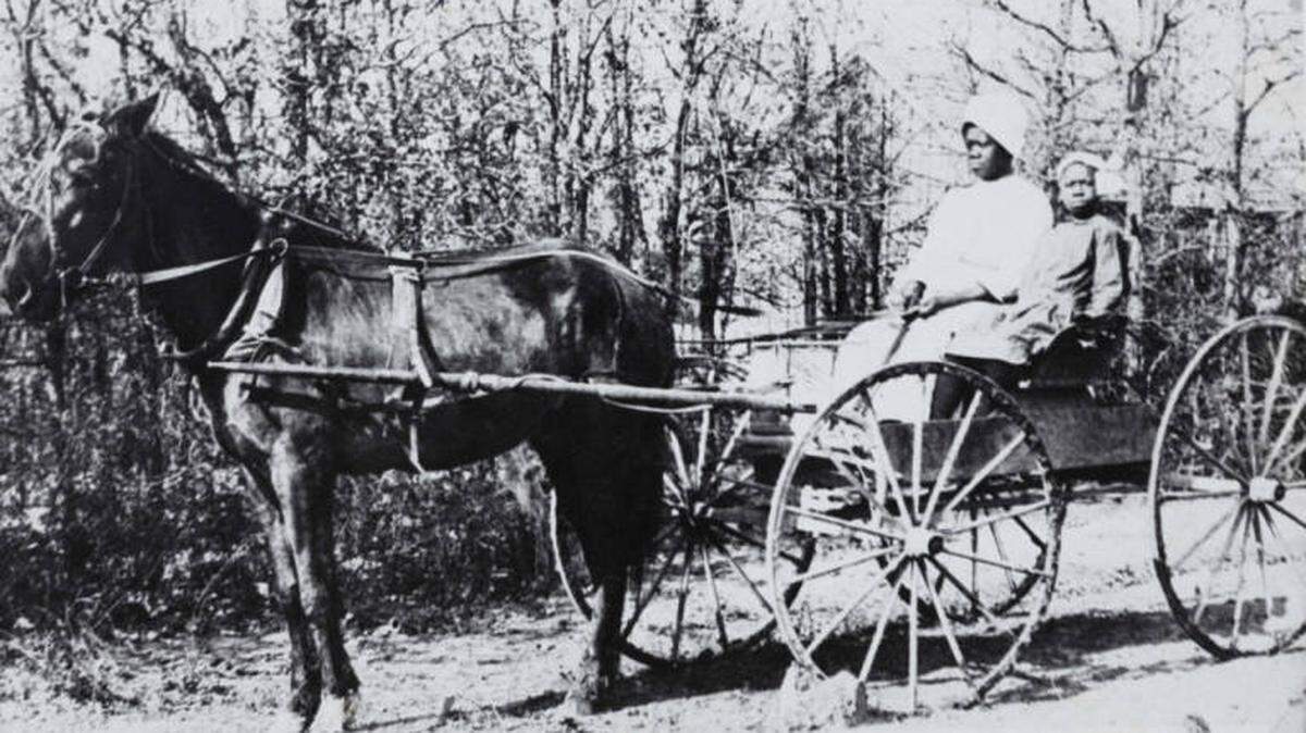 A mother and daughter travel to a Juneteenth celebration in the 1880s.