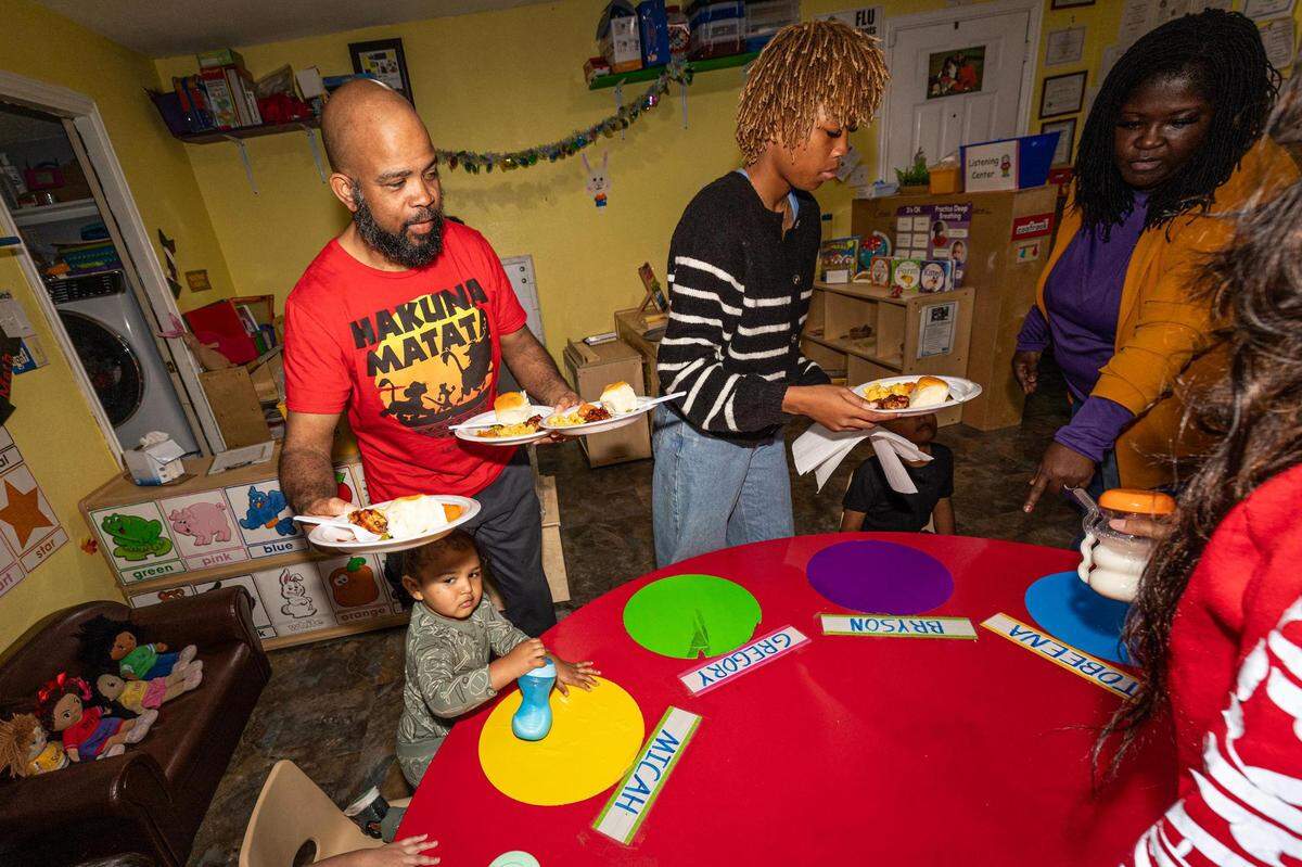 Michael and his daughter Halle Chaney serve dinner to the students in the evening at the Future Scholars’ Childcare and Transportation child care home in Grand Prairie on Thursday, March 14, 2024. Future Scholars’ is one of few programs in Tarrant County that provide 24/7 child care.