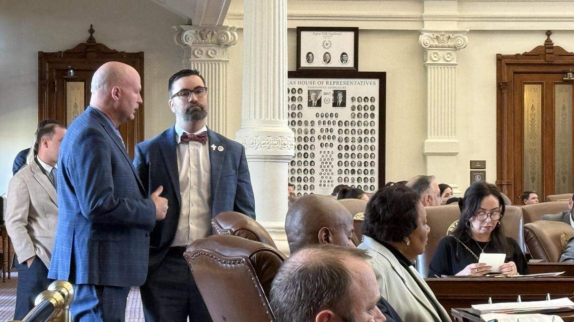 State Rep. Tony Tinderholt and State Rep. David Lowe talk in the House chamber at the Texas Capitol on April 9, 2025.