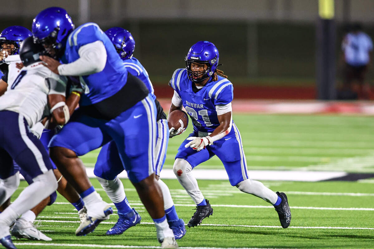 Dunbar running back JaMarion Garrett looks for running room against Wyatt on Thursday, September 5, 2024 at Clark Stadium in Fort Worth, Texas. Dunbar rallied to defeat Wyatt 14-13.