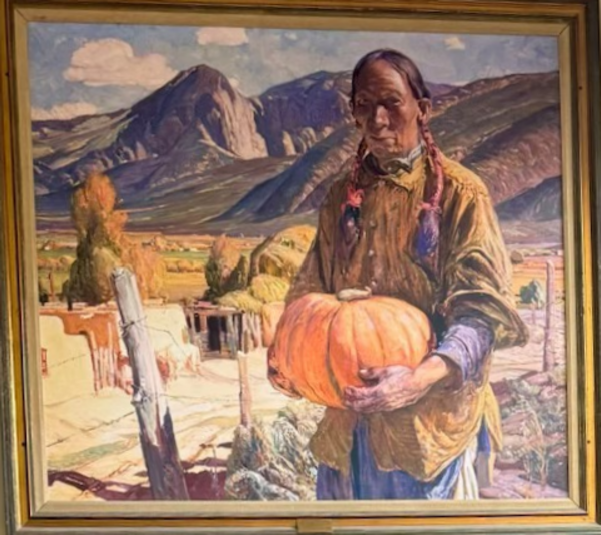 A print of the October-Taos painting by Oscar E. Berninghaus hangs in Mauro Serrano’s home.